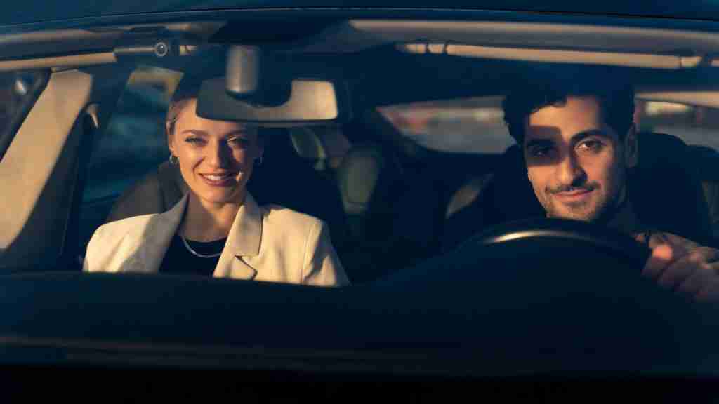 Private Driver transporting passenger in luxury car