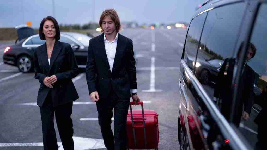 Private Driver assisting business travellers with luggage
