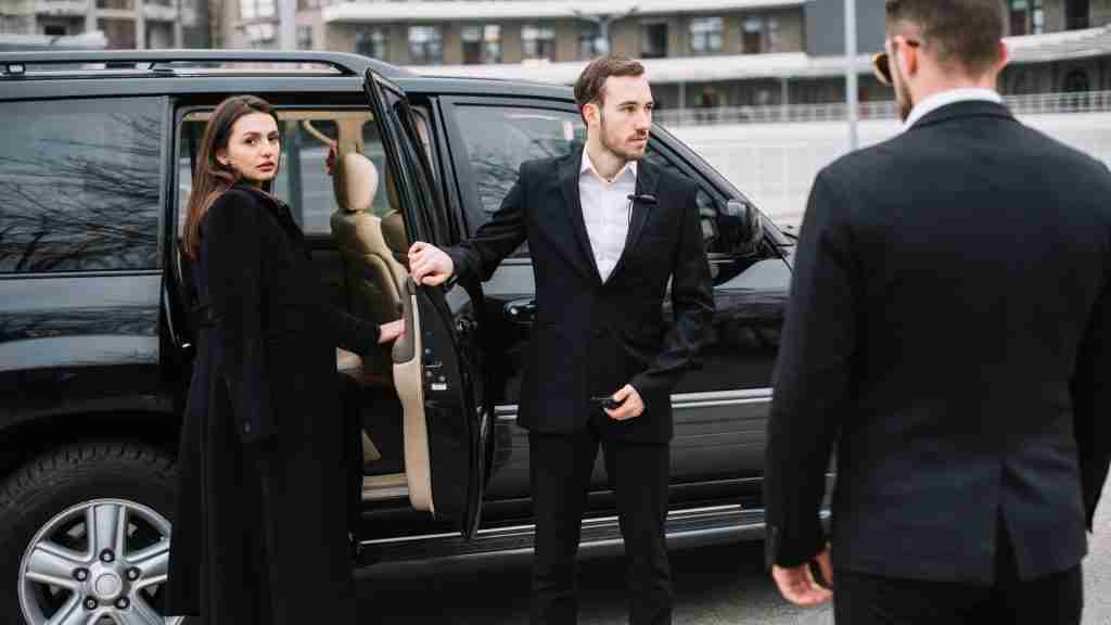 Airport Chauffeur Service with professional driver and passenger.