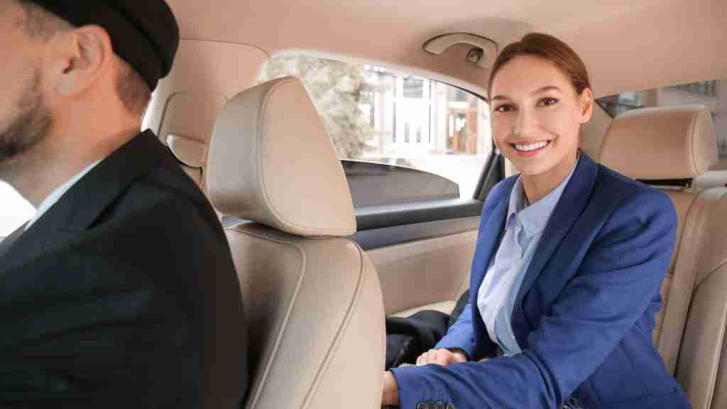 Chauffeur service in Melbourne woman smiling in car